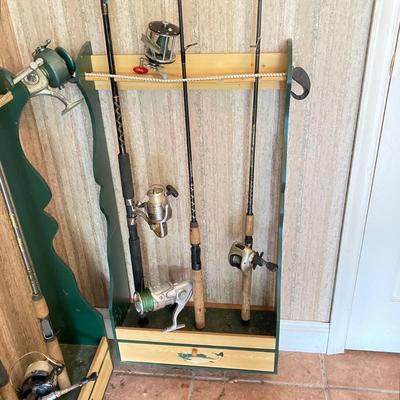 LOT 120: Wooden Fishing Rod Holder with Rods and Reels