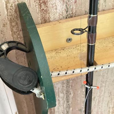 LOT 120: Wooden Fishing Rod Holder with Rods and Reels