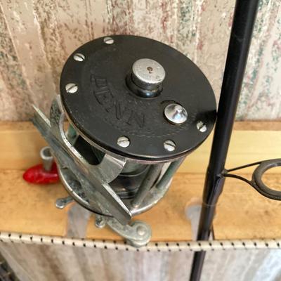 LOT 120: Wooden Fishing Rod Holder with Rods and Reels