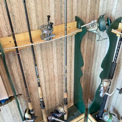 LOT 120: Wooden Fishing Rod Holder with Rods and Reels