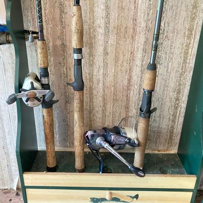 LOT 120: Wooden Fishing Rod Holder with Rods and Reels