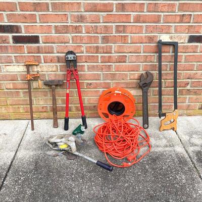 LOT 123: Collection of Tools Including a Plumber Wrench, Bolt Cutter Clamps, Saw, Extension Cord and Spool
