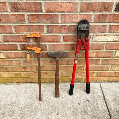 LOT 123: Collection of Tools Including a Plumber Wrench, Bolt Cutter Clamps, Saw, Extension Cord and Spool