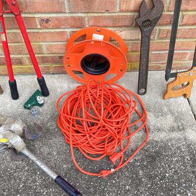 LOT 123: Collection of Tools Including a Plumber Wrench, Bolt Cutter Clamps, Saw, Extension Cord and Spool