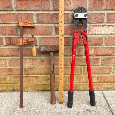 LOT 123: Collection of Tools Including a Plumber Wrench, Bolt Cutter Clamps, Saw, Extension Cord and Spool