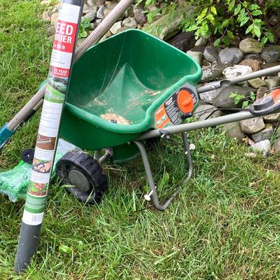 LOT 133: Gardening Tools Including Rakes, Seed Spreader, Ax, Hose and More