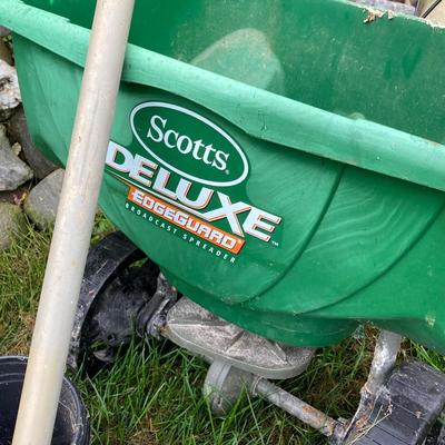 LOT 133: Gardening Tools Including Rakes, Seed Spreader, Ax, Hose and More