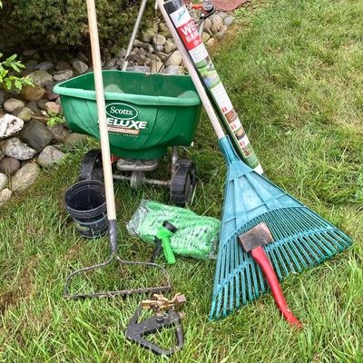 LOT 133: Gardening Tools Including Rakes, Seed Spreader, Ax, Hose and More