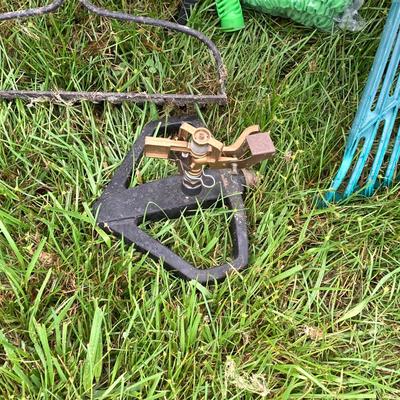 LOT 133: Gardening Tools Including Rakes, Seed Spreader, Ax, Hose and More