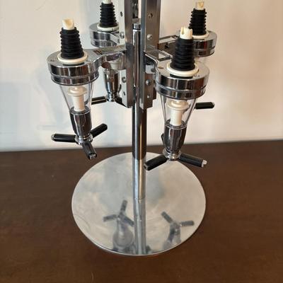 LOT 145: Revolving Liquor Caddy, Hand Crafted Cheese & Cracker Jug, Oversize Stell Artois & Champagne Glasses