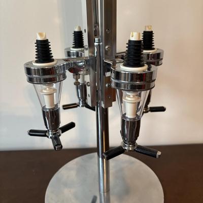 LOT 145: Revolving Liquor Caddy, Hand Crafted Cheese & Cracker Jug, Oversize Stell Artois & Champagne Glasses