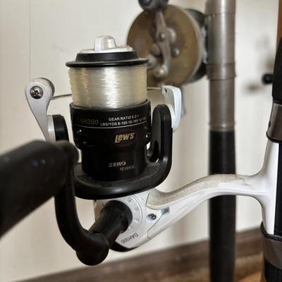 LOT 146: Fishing Rod Holder w/Fishing Rods & Reels
