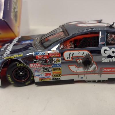 Sale Photo Thumbnail #1067: Action Dale Earnhardt Extreme Limited Edition 1997 Monte Carlo #3 GM Goodwrench NASCAR Die Cast Stock Car in Original Box.  Raced version is the replica finish condition of the car at race end.