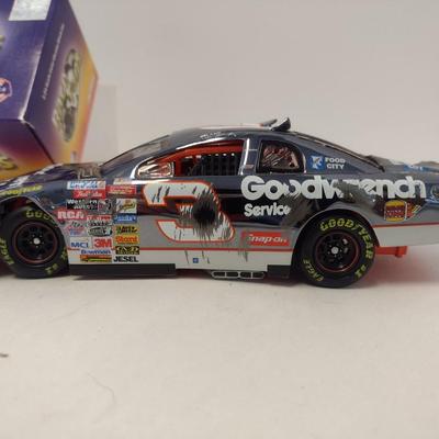 Sale Photo Thumbnail #1066: Action Dale Earnhardt Extreme Limited Edition 1997 Monte Carlo #3 GM Goodwrench NASCAR Die Cast Stock Car in Original Box.  Raced version is the replica finish condition of the car at race end.