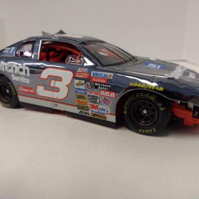 Sale Photo Thumbnail #1069: Action Dale Earnhardt Extreme Limited Edition 1997 Monte Carlo #3 GM Goodwrench NASCAR Die Cast Stock Car in Original Box.  Raced version is the replica finish condition of the car at race end.