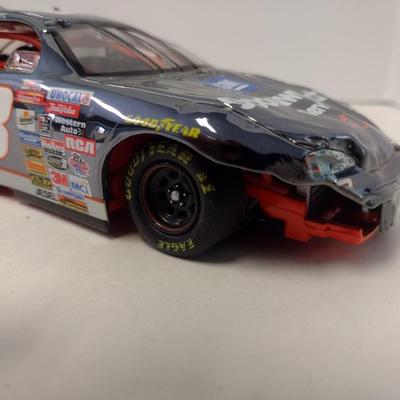Sale Photo Thumbnail #1070: Action Dale Earnhardt Extreme Limited Edition 1997 Monte Carlo #3 GM Goodwrench NASCAR Die Cast Stock Car in Original Box.  Raced version is the replica finish condition of the car at race end.