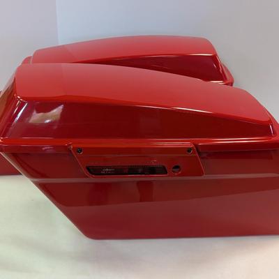 Sale Photo Thumbnail #1555: The Harley Red Ultra Road Street Glide Roadking Hard Saddlebags are high-quality motorcycle accessories designed for maximum storage and protection. These saddlebags are durable and provide ample space for storing belongings while riding the road. The red