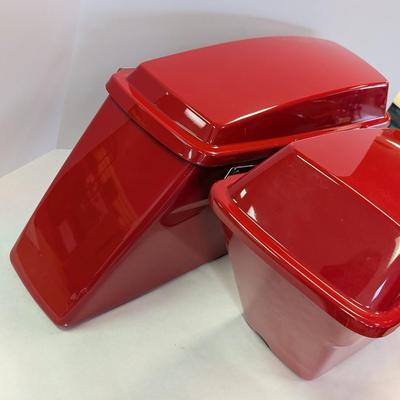 Sale Photo Thumbnail #1556: The Harley Red Ultra Road Street Glide Roadking Hard Saddlebags are high-quality motorcycle accessories designed for maximum storage and protection. These saddlebags are durable and provide ample space for storing belongings while riding the road. The red