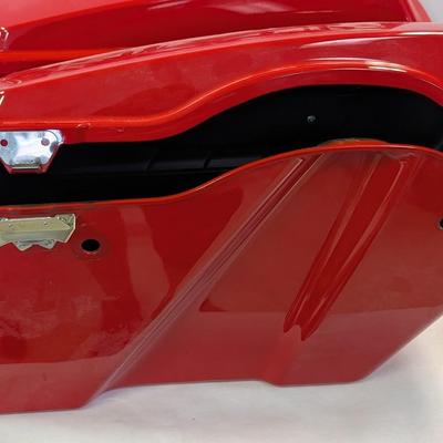 Sale Photo Thumbnail #1561: The Harley Red Ultra Road Street Glide Roadking Hard Saddlebags are high-quality motorcycle accessories designed for maximum storage and protection. These saddlebags are durable and provide ample space for storing belongings while riding the road. The red