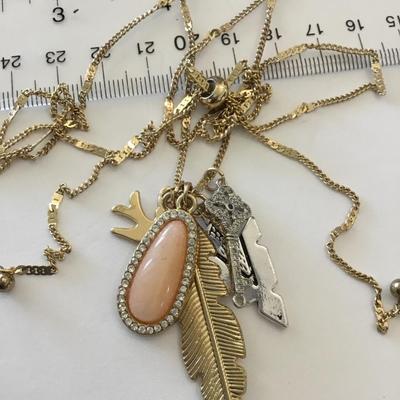 Beautiful, golden, silver toned charm necklace