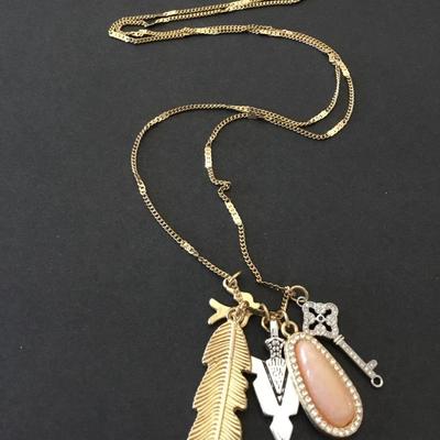 Beautiful, golden, silver toned charm necklace