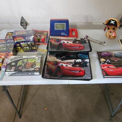 Sale Photo Thumbnail #165: Cars the movie book tote bag lot
Receive everything pictured
Includes two Shrek puzzles, vintage cartoon watches and other toys