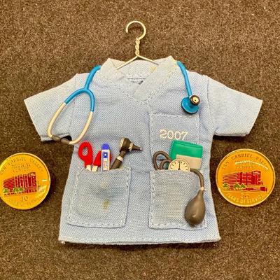 Sale Photo Thumbnail #488: Size of the coat is similar to Barbi clothes. Copat is on a hanger, with a stethoscope, scissors, thermometer, blood pressure cuff and otoscope. 30 service pins are for San Gabriel Valley medical center.