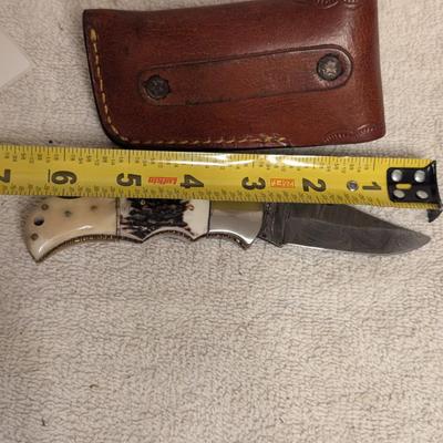 Sale Photo Thumbnail #222: folding knife with leather sheath