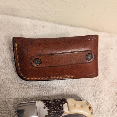 Sale Photo Thumbnail #218: folding knife with leather sheath