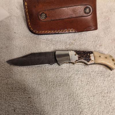 Sale Photo Thumbnail #219: folding knife with leather sheath