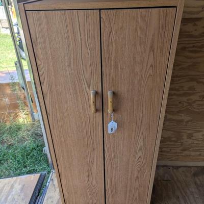 Storage cabinet 52 tall 12 in deep 31 in wide
