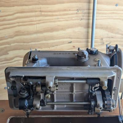 Singer sewing machine in cabinet
