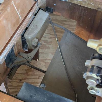 Singer sewing machine in cabinet