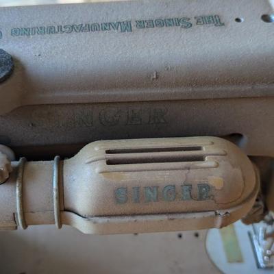 Singer sewing machine in cabinet