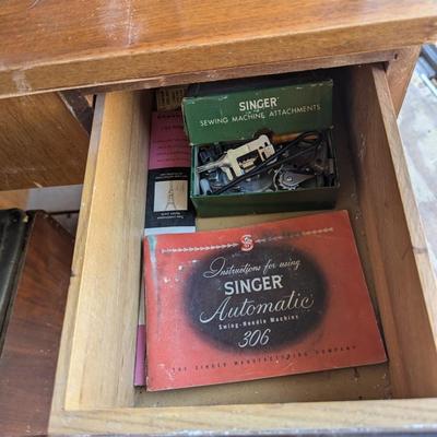 Singer sewing machine in cabinet
