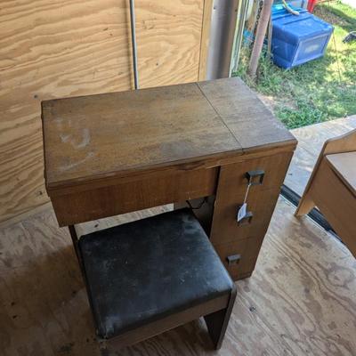 Singer sewing machine in cabinet