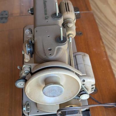Singer sewing machine in cabinet