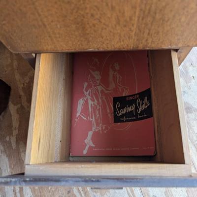 Singer sewing machine in cabinet