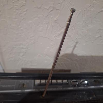 Sale Photo Thumbnail #1088: plugged in and tested radio, sounds great.  No cassettes available to test that part.  Antenna is good. It needs a good cleaning. And the handle is secure on it but doesn't stay in the up position on both sidessee photos.
