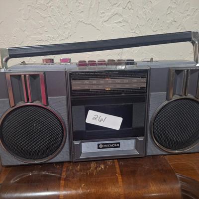 Sale Photo Thumbnail #1081: plugged in and tested radio, sounds great.  No cassettes available to test that part.  Antenna is good. It needs a good cleaning. And the handle is secure on it but doesn't stay in the up position on both sidessee photos.