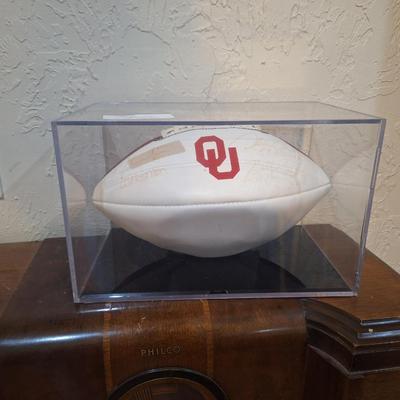 Sale Photo Thumbnail #1260: OU football signed by Billy Sims, Steve Owens and Jason White- signatures are faded