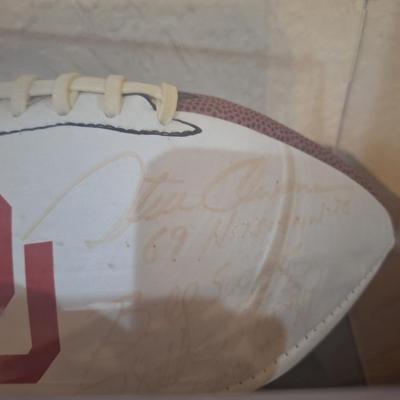 Sale Photo Thumbnail #1261: OU football signed by Billy Sims, Steve Owens and Jason White- signatures are faded