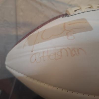 Sale Photo Thumbnail #1262: OU football signed by Billy Sims, Steve Owens and Jason White- signatures are faded