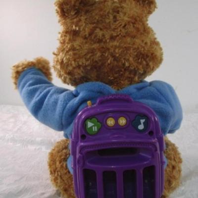Sale Photo Thumbnail #211: A story-telling toy from Hasbro, see pictures, 9-1/2" x 12" x 14", bear only does not have additional books or inserts. Sings, talks, nods his head, raises his hands, wiggles his ears, eyes open & close, mouth moves, has games, takes 4 D batteries not inc