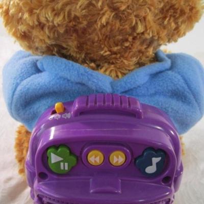 Sale Photo Thumbnail #212: A story-telling toy from Hasbro, see pictures, 9-1/2" x 12" x 14", bear only does not have additional books or inserts. Sings, talks, nods his head, raises his hands, wiggles his ears, eyes open & close, mouth moves, has games, takes 4 D batteries not inc