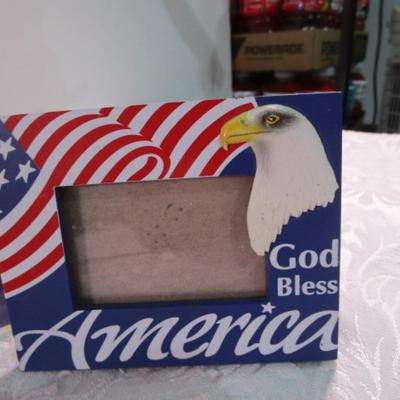 Sale Photo Thumbnail #354: 1 framed picture 15-1/2" x 13-1/2", pin cushon, metal flag, book on the constitution, picture in clear frame, 1 pamphlet on the constitution, 1 flag picture frame, 4 ornaments (liquid filled), basket