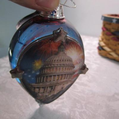 Sale Photo Thumbnail #335: 1 framed picture 15-1/2" x 13-1/2", pin cushon, metal flag, book on the constitution, picture in clear frame, 1 pamphlet on the constitution, 1 flag picture frame, 4 ornaments (liquid filled), basket