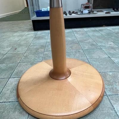 Sale Photo Thumbnail #7: Light Maple colored table with a black glass top.  Table has a round base with brushed metal band on the riser.  The serial number for this table is 052829.  The table was made in Italy. Please note the scratches in the black glass top.  Top is 17 3/4" sq
