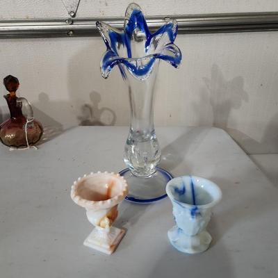 Sale Photo Thumbnail #215: Two Vintage Akro Agate Orange White & Blue Slag Glass Urn Trophy Toothpick Holder

Will receive both items and are in great condition