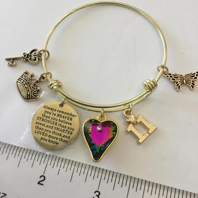 Beautiful, gold, toned, extendable charm bracelet very nice
